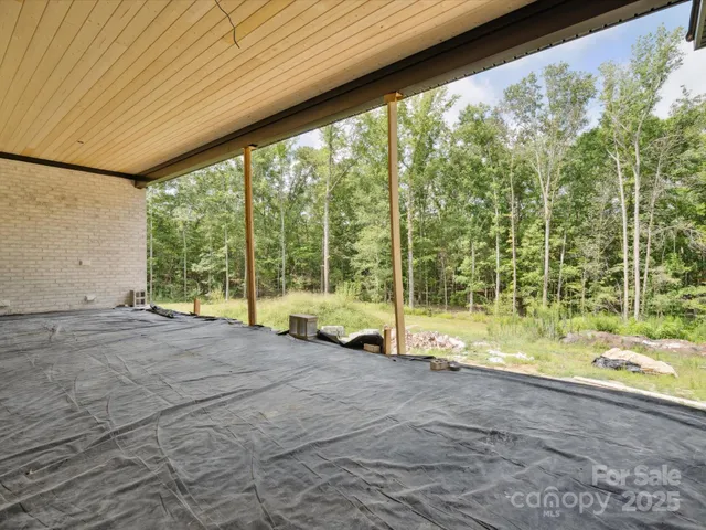 a aerial view of a house with a yard