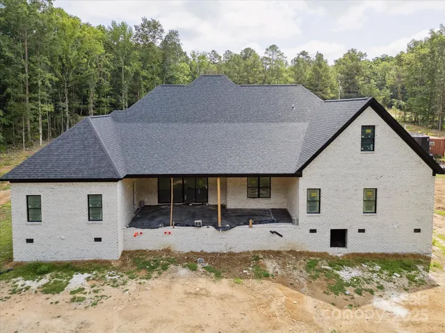a house with trees in the background