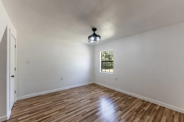 a view of a livingroom with wooden floor