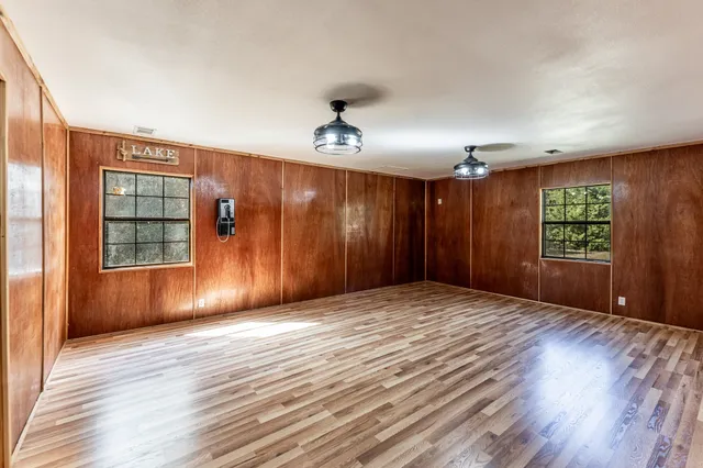 a view of hallway with wooden floor