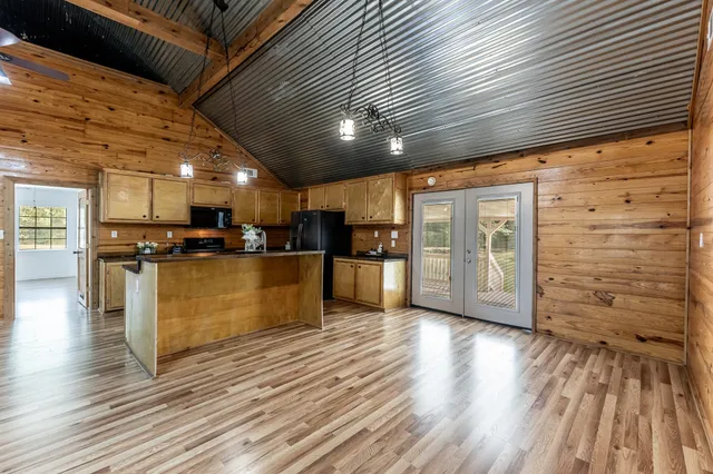 a view of kitchen with stainless steel appliances kitchen island