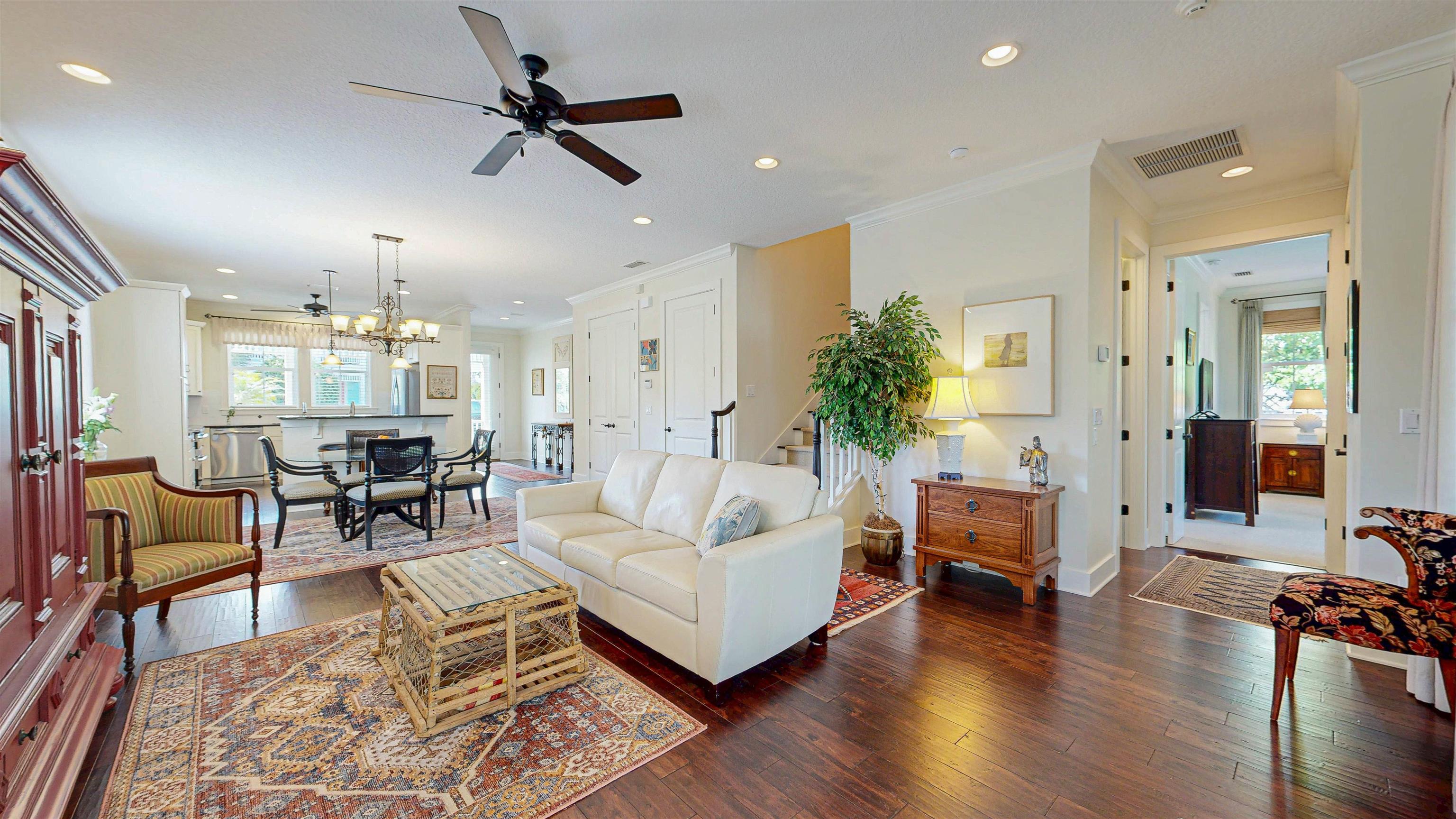 200 12th Street St. Augustine, FL 32080 - Photo 11 of 42 a living room with furniture and a chandelier