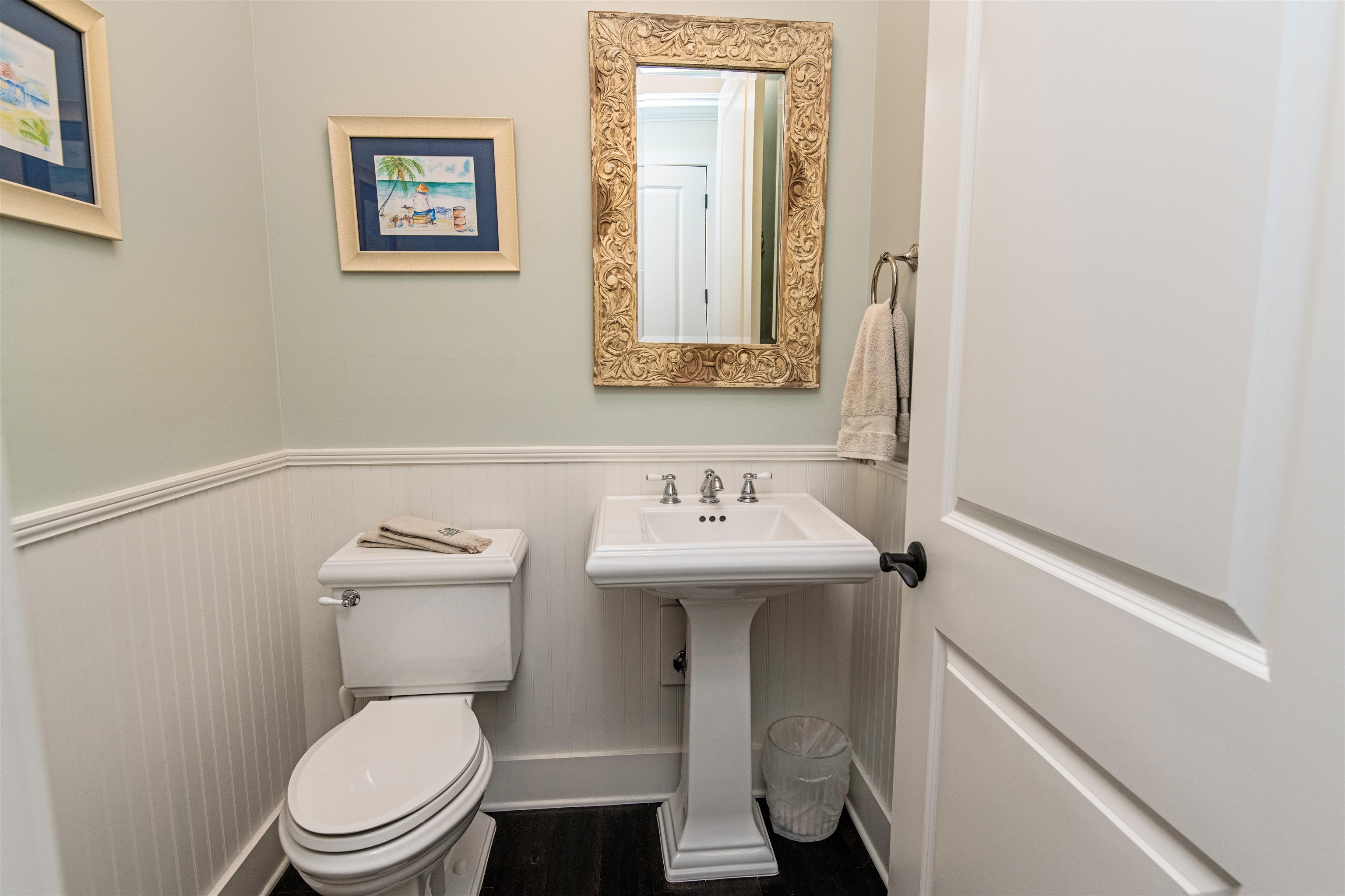 200 12th Street St. Augustine, FL 32080 - Photo 18 of 42 a bathroom with a sink a toilet and mirror
