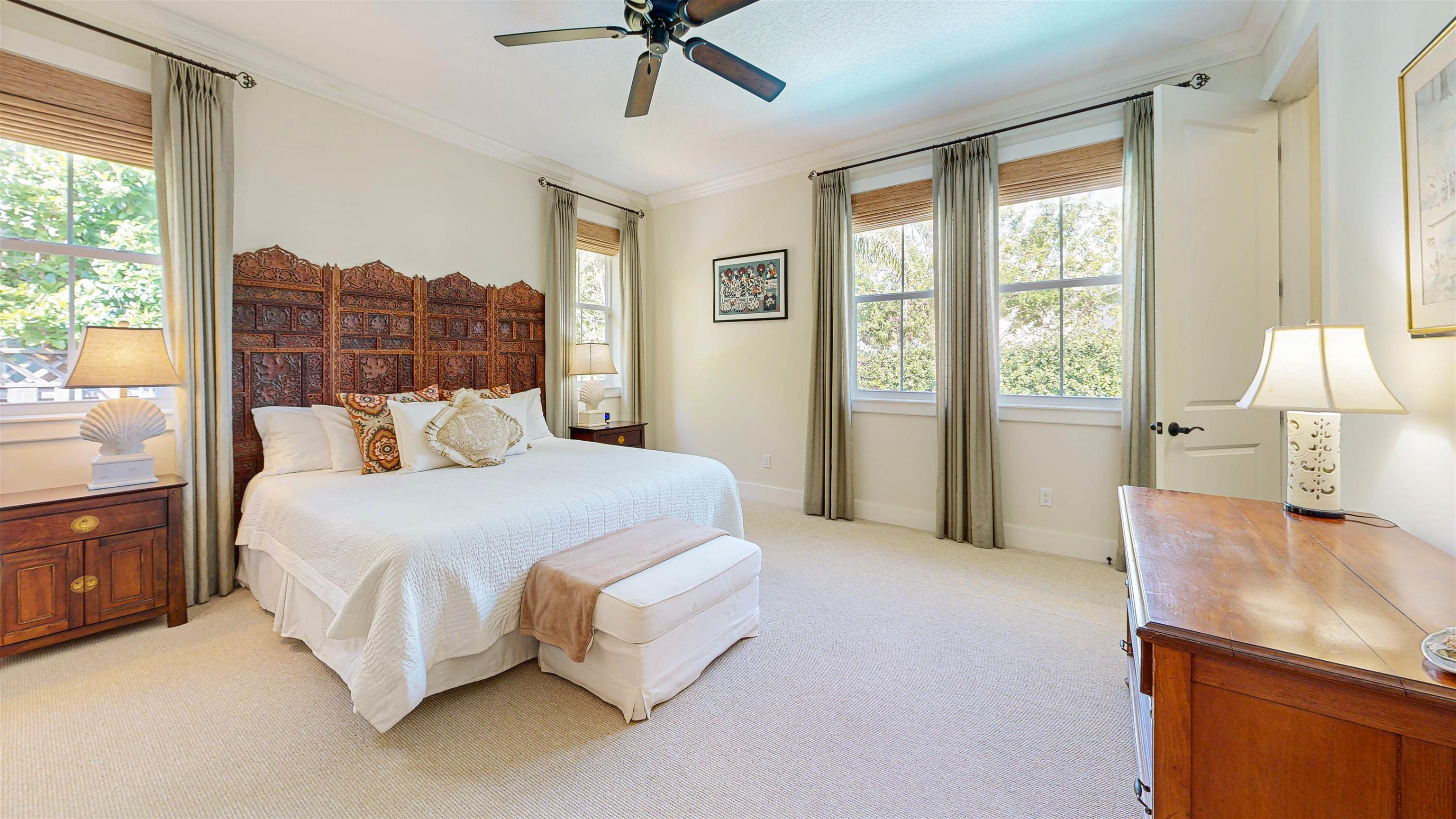 200 12th Street St. Augustine, FL 32080 - Photo 20 of 42 a large bed sitting in a bedroom next to a window