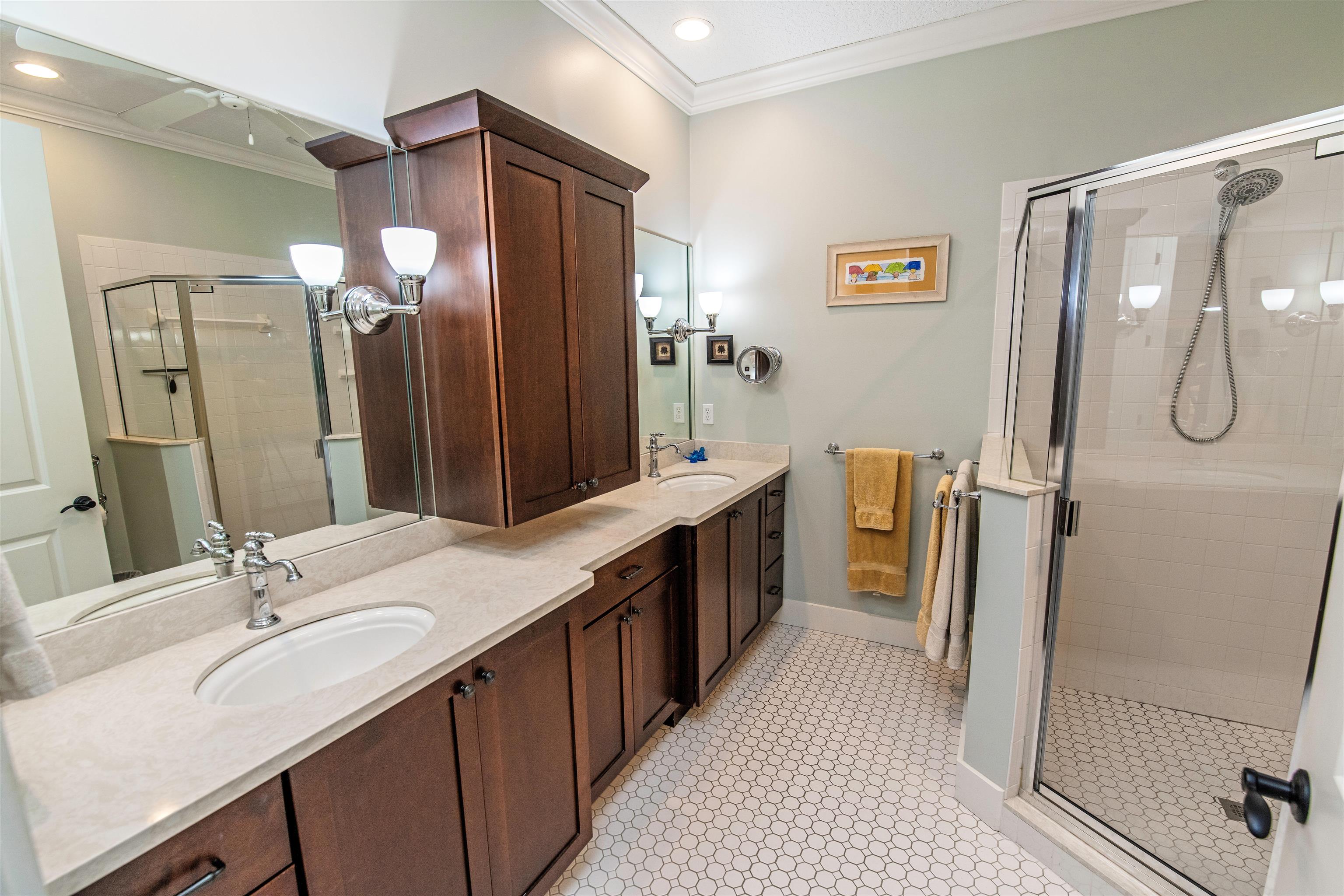 200 12th Street St. Augustine, FL 32080 - Photo 23 of 42 a bathroom with a double vanity sink a double vanity and a mirror