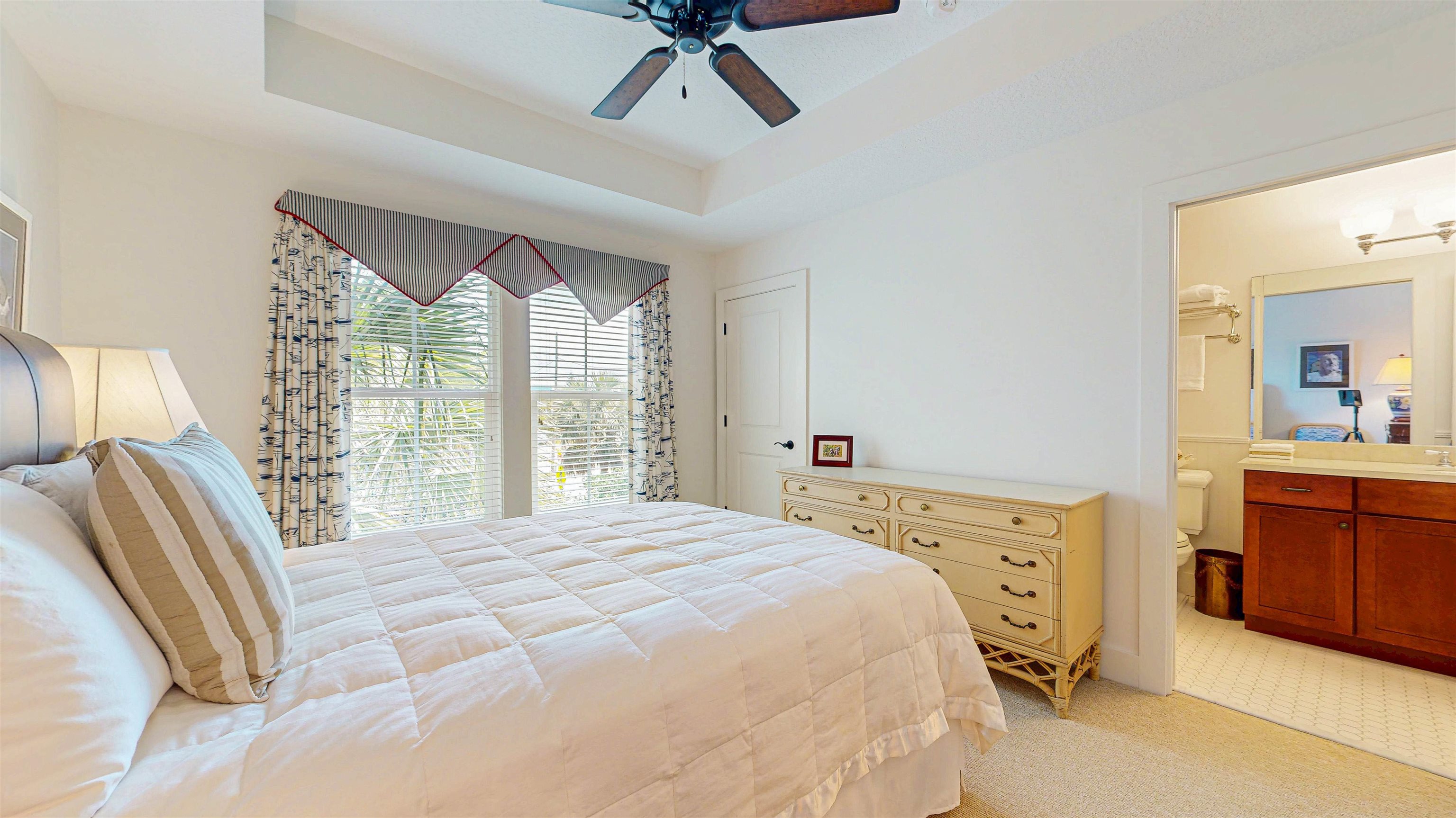 200 12th Street St. Augustine, FL 32080 - Photo 25 of 42 a bedroom with a bed dresser and a window