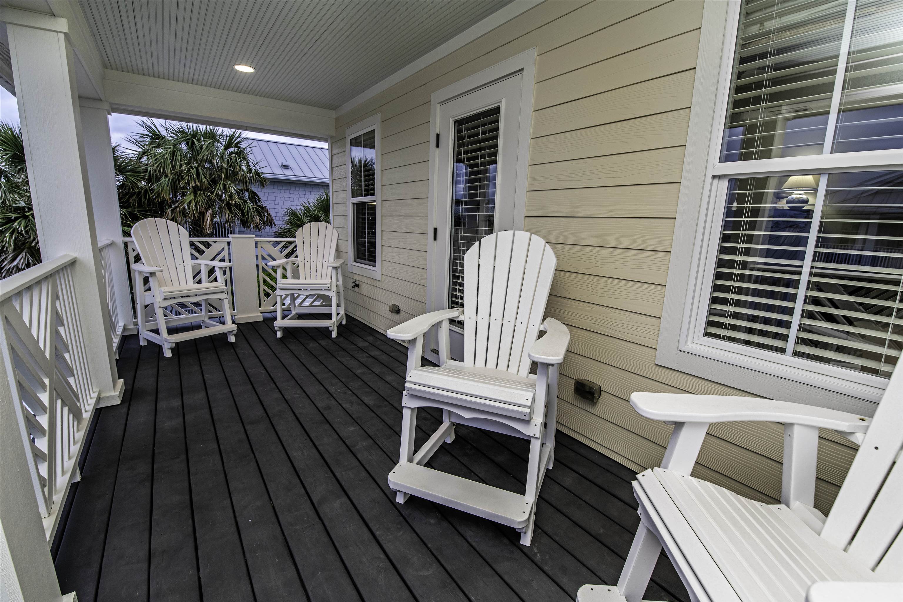 200 12th Street St. Augustine, FL 32080 - Photo 31 of 42 a view of balcony with wooden floor and outdoor seating