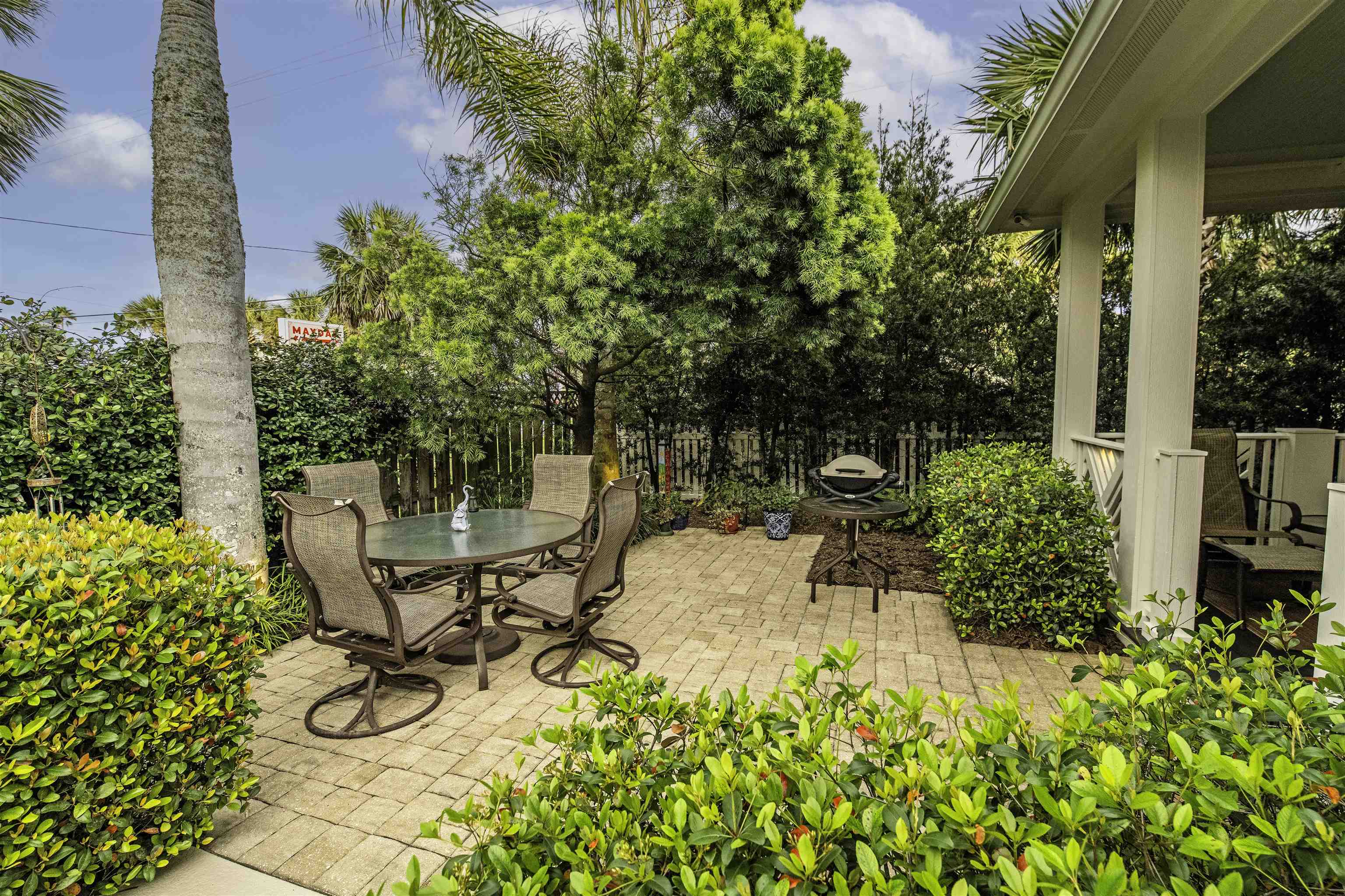 200 12th Street St. Augustine, FL 32080 - Photo 37 of 42 a view of a chair and table in the garden