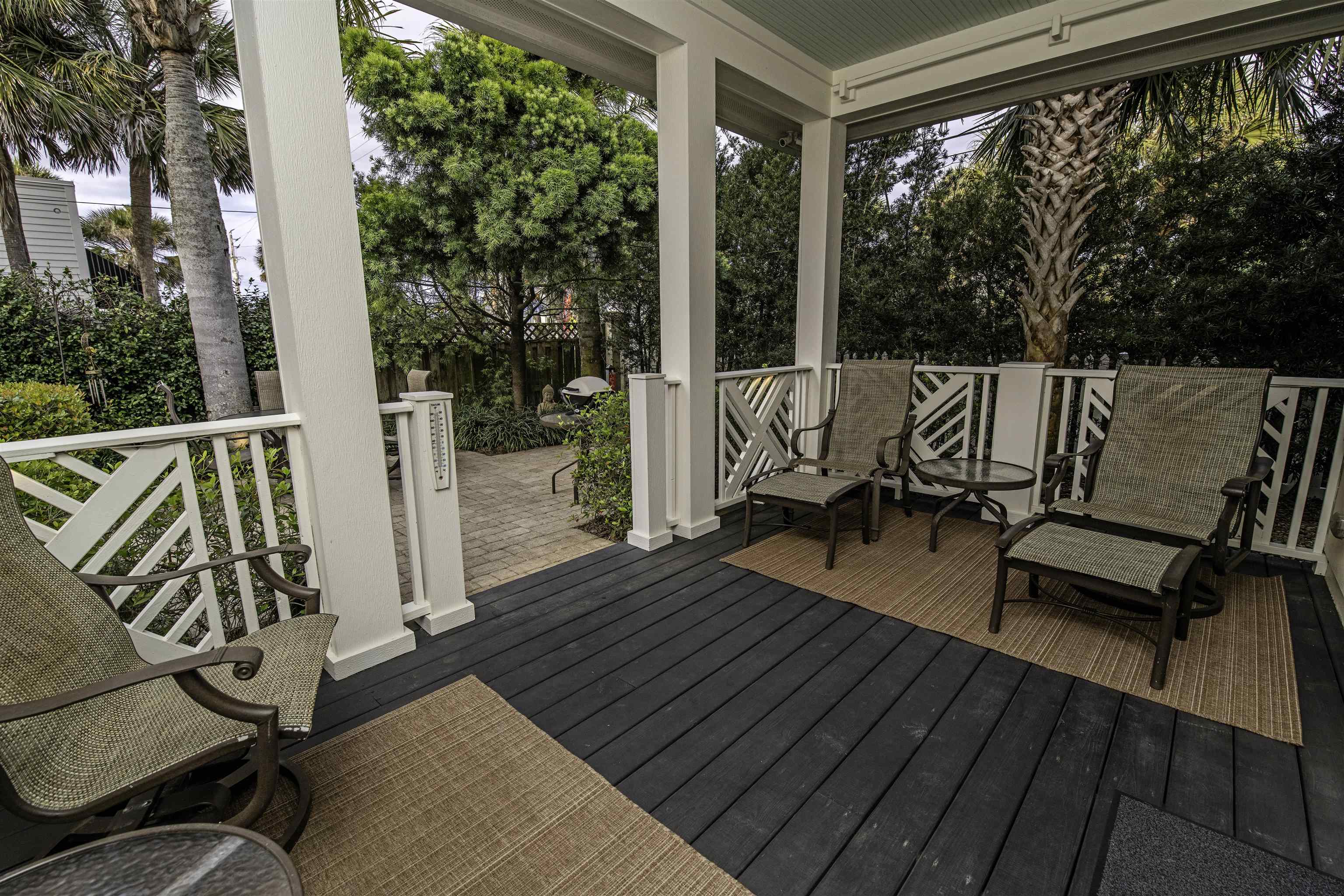 200 12th Street St. Augustine, FL 32080 - Photo 38 of 42 a balcony with wooden floor table and chairs