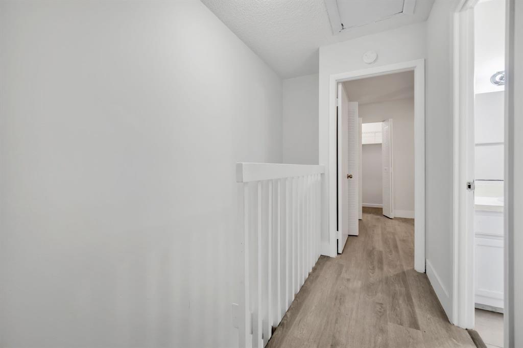 7743 Balboa Street, Unit 7743 Sunrise, FL 33351 - Photo 13 of 21 a view of a hallway with a wooden floor