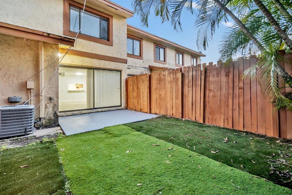 7743 Balboa Street, Unit 7743 Sunrise, FL 33351 - Photo 20 of 21 a view of a back yard of the house