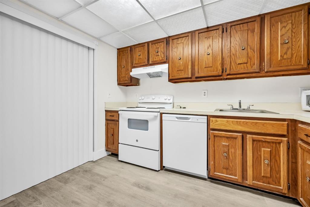7743 Balboa Street, Unit 7743 Sunrise, FL 33351 - Photo 6 of 21 a kitchen with granite countertop cabinets stainless steel appliances and sink