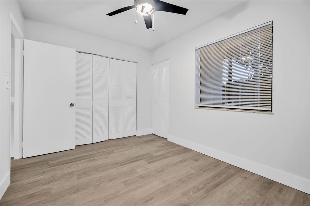 7743 Balboa Street, Unit 7743 Sunrise, FL 33351 - Photo 10 of 21 a view of an empty room with wooden floor and a window