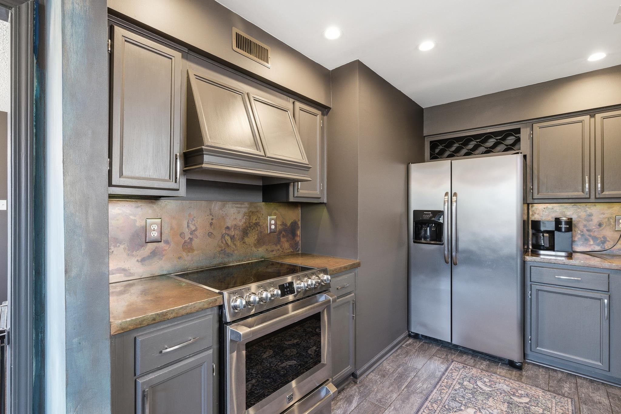3546 Ripplechase Drive Bartlett, TN 38133 - Photo 11 of 24 a kitchen with granite countertop a stainless steel appliances cabinets and a counter top space