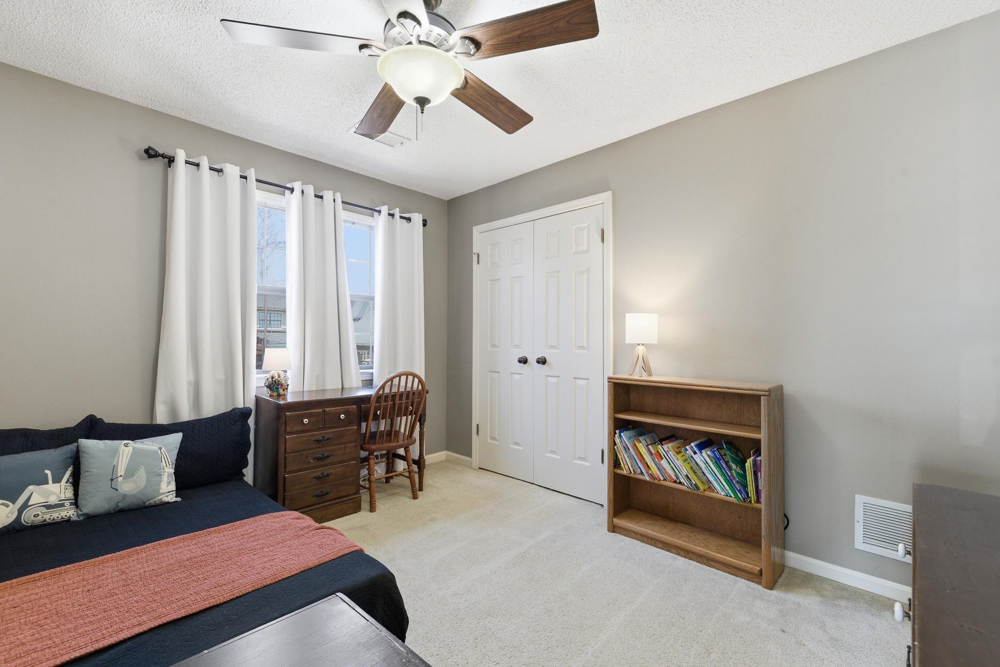 3546 Ripplechase Drive Bartlett, TN 38133 - Photo 20 of 24 a bedroom with furniture and a chandelier