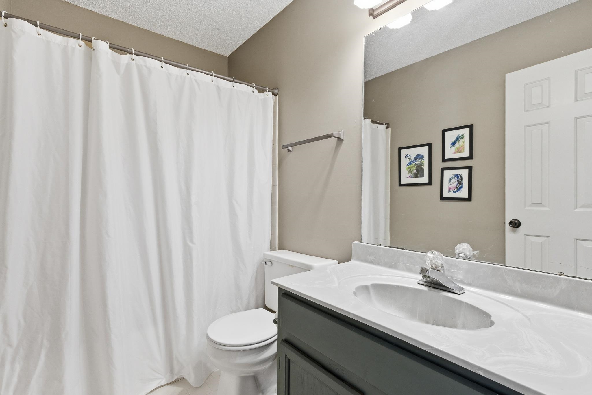 3546 Ripplechase Drive Bartlett, TN 38133 - Photo 22 of 24 a bathroom with a sink and a mirror