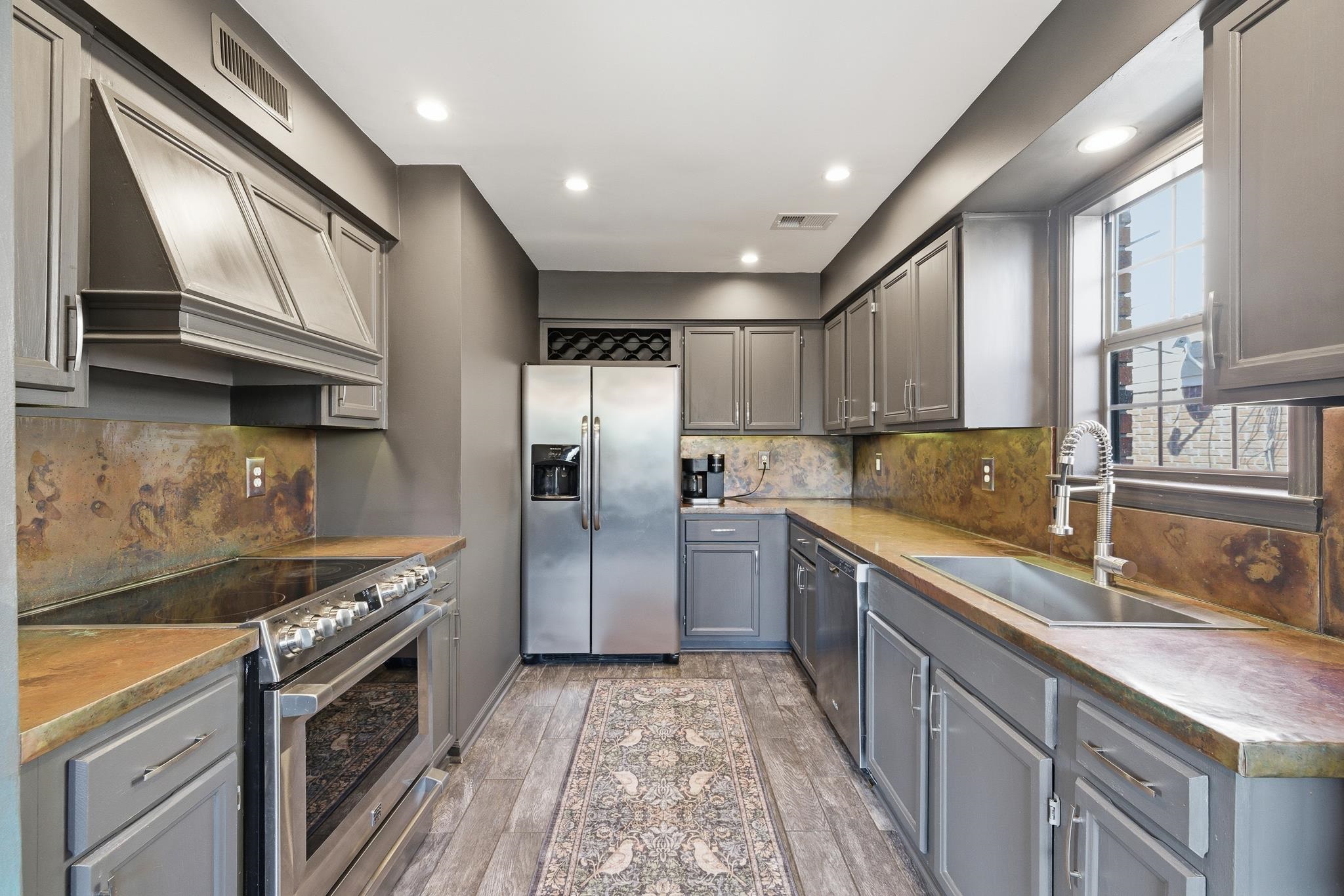 3546 Ripplechase Drive Bartlett, TN 38133 - Photo 10 of 24 a kitchen with granite countertop a sink stainless steel appliances and cabinets