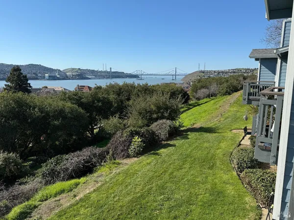 a view of a garden with a building in the background