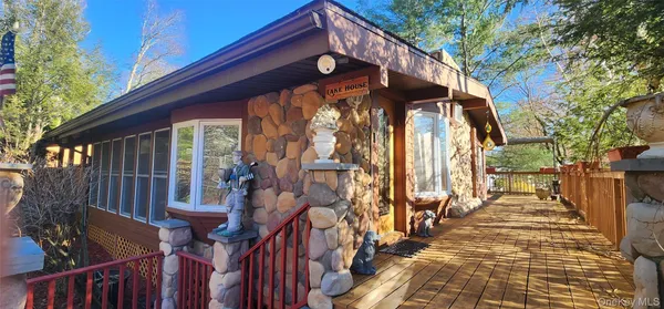 a view of a house with a small yard