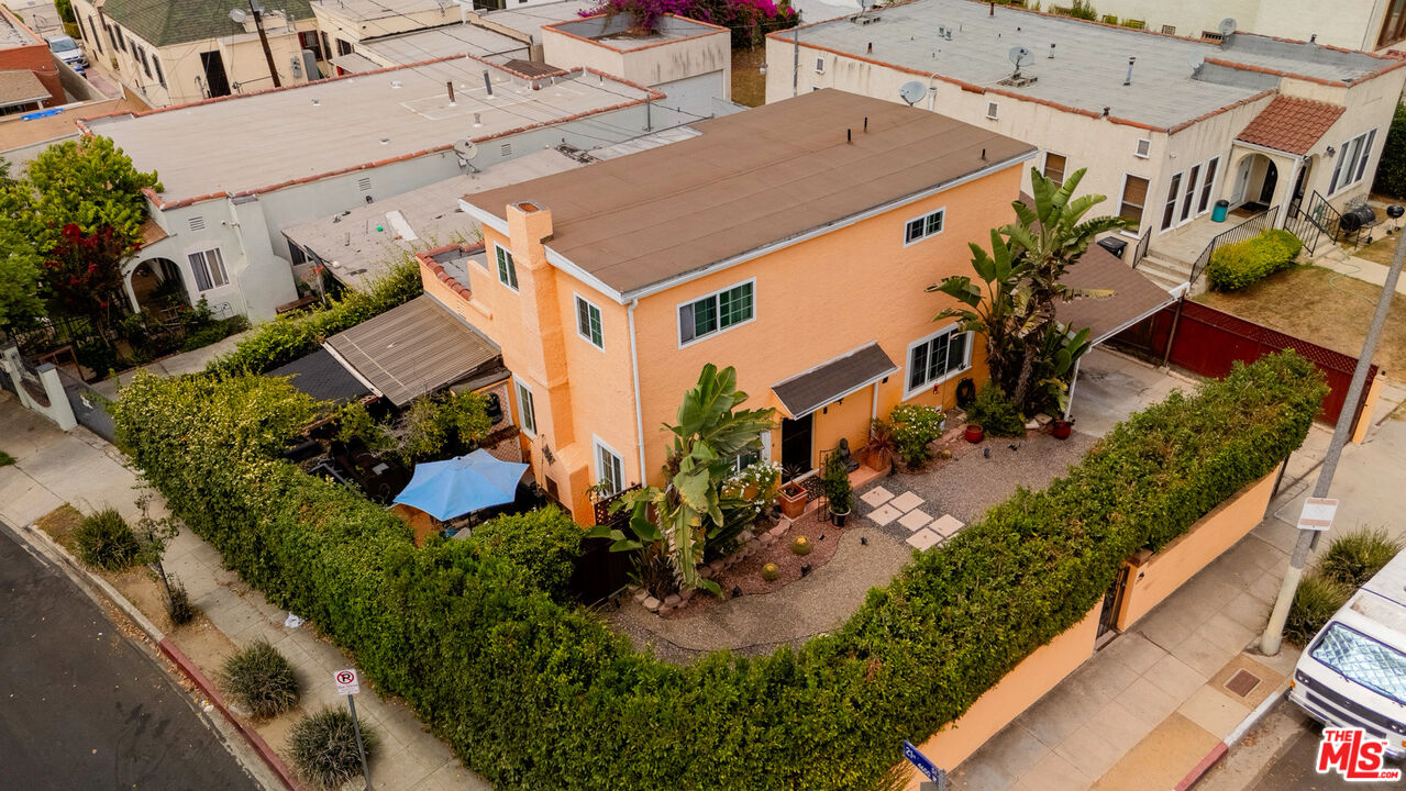 an aerial view of a house with outdoor space