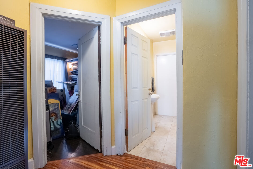 2045 Claudina Avenue Los Angeles, CA 90016 - Photo 19 of 33 a view of a bathroom from a hallway