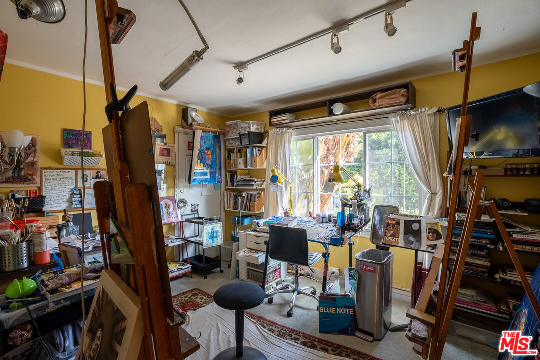 2045 Claudina Avenue Los Angeles, CA 90016 - Photo 23 of 33 a view of a livingroom with furniture staircase and a floor to ceiling window