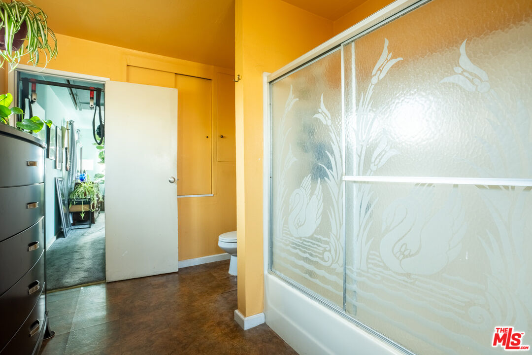 2045 Claudina Avenue Los Angeles, CA 90016 - Photo 28 of 33 a bathroom with a shower and a sink
