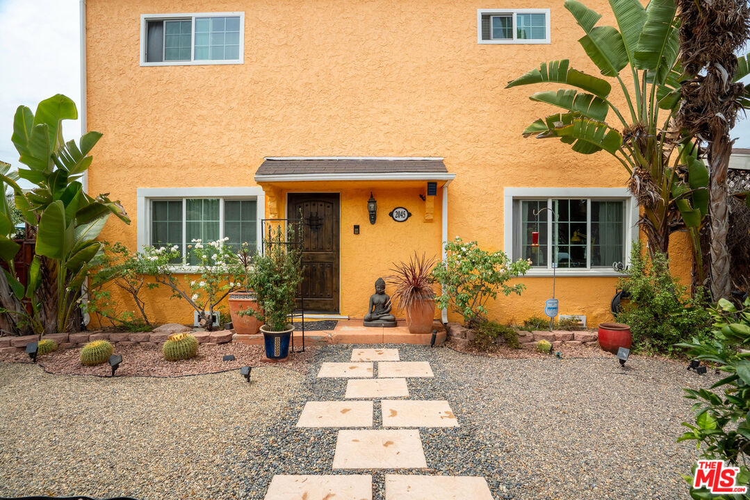2045 Claudina Avenue Los Angeles, CA 90016 - Photo 3 of 33 a view of a house with backyard and sitting area