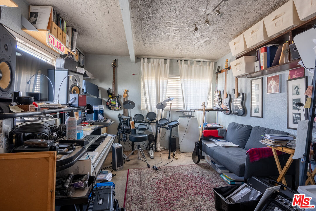 2045 Claudina Avenue Los Angeles, CA 90016 - Photo 33 of 33 a living room with furniture a air conditioner and a window