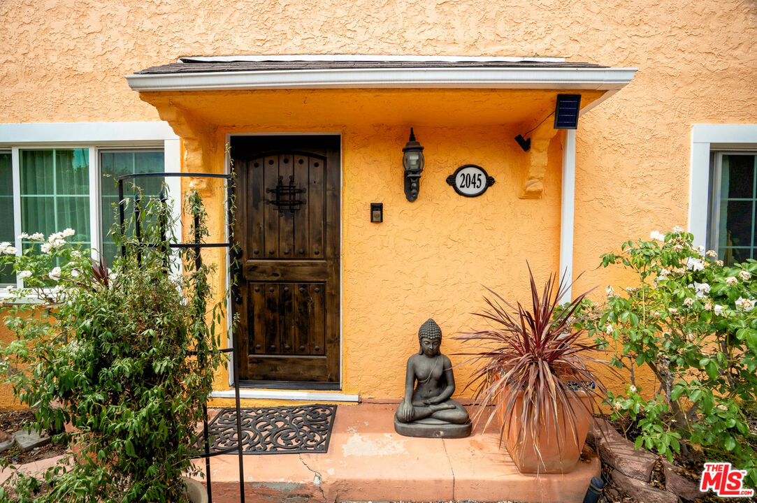 2045 Claudina Avenue Los Angeles, CA 90016 - Photo 6 of 33 a front view of a house with a glass door