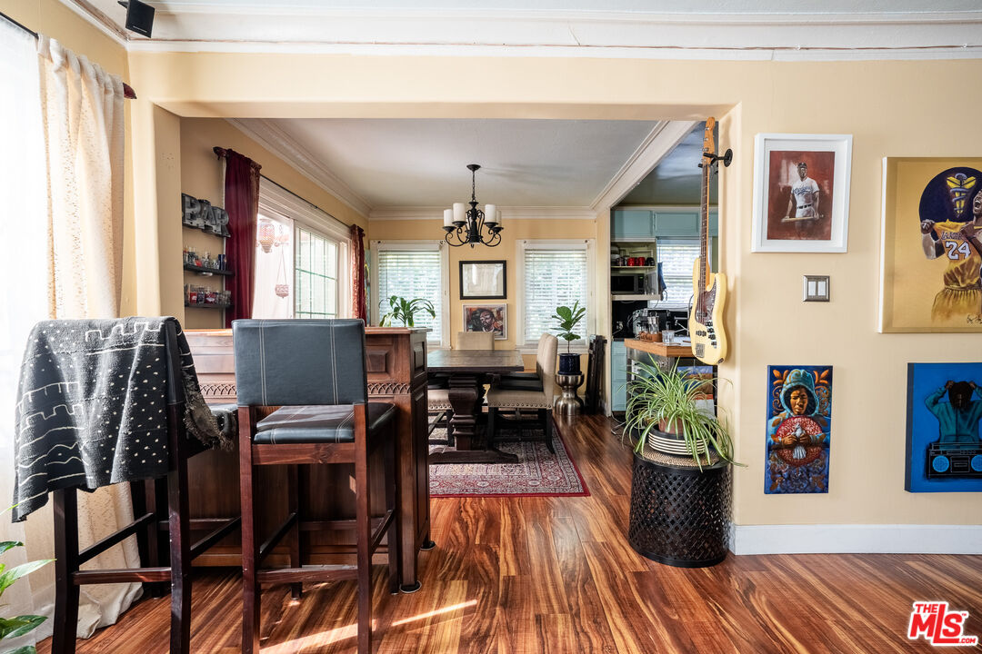 2045 Claudina Avenue Los Angeles, CA 90016 - Photo 8 of 33 a living room with furniture and a wooden floor