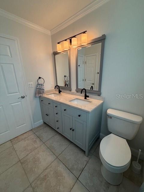3856 Tarpon Road Venice, FL 34293 - Photo 14 of 24 a bathroom with a toilet sink and mirror