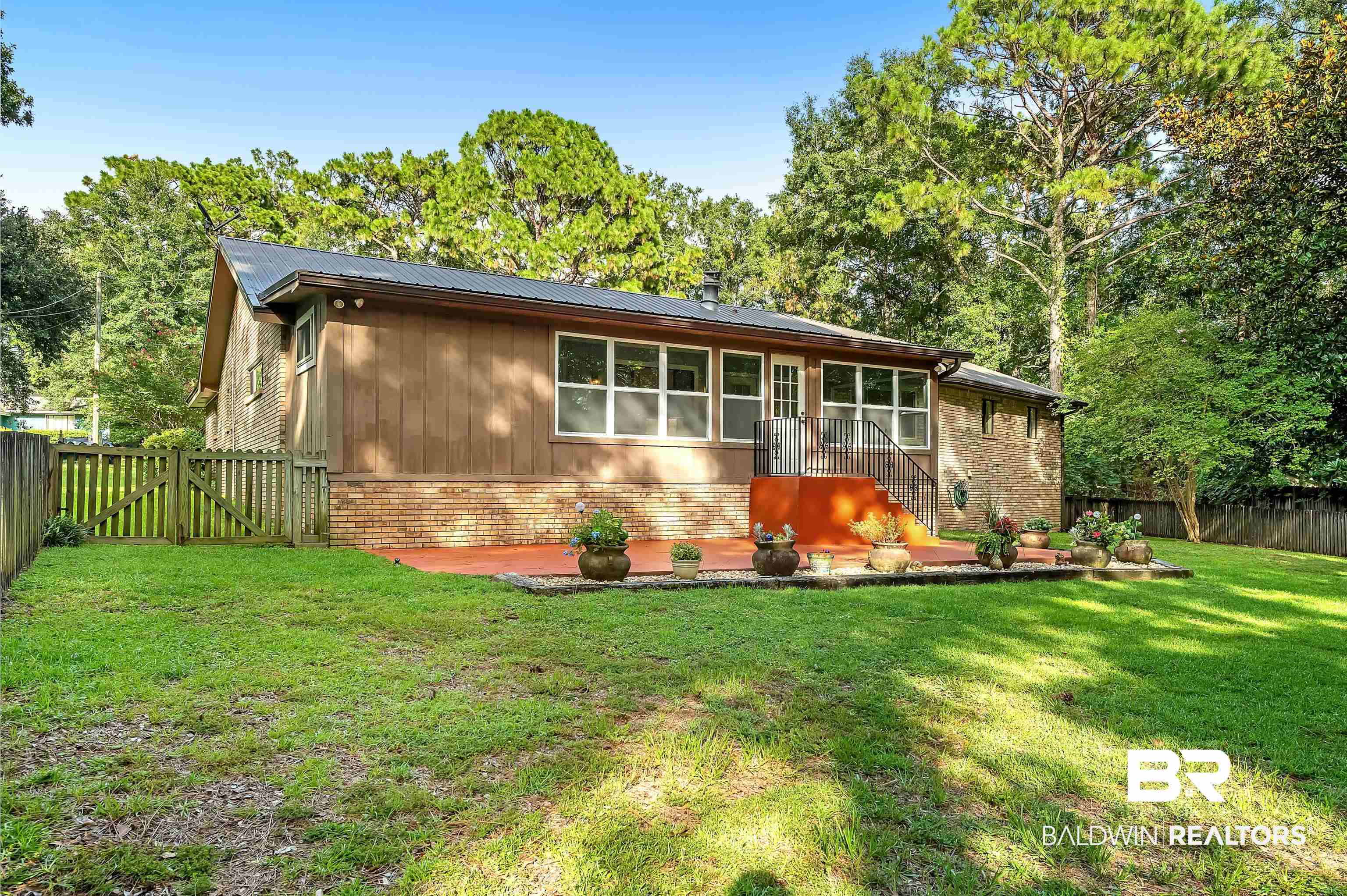 104 James Circle Daphne, AL 36526 - Photo 7 of 62 Ranch-style house with a patio area and a front lawn