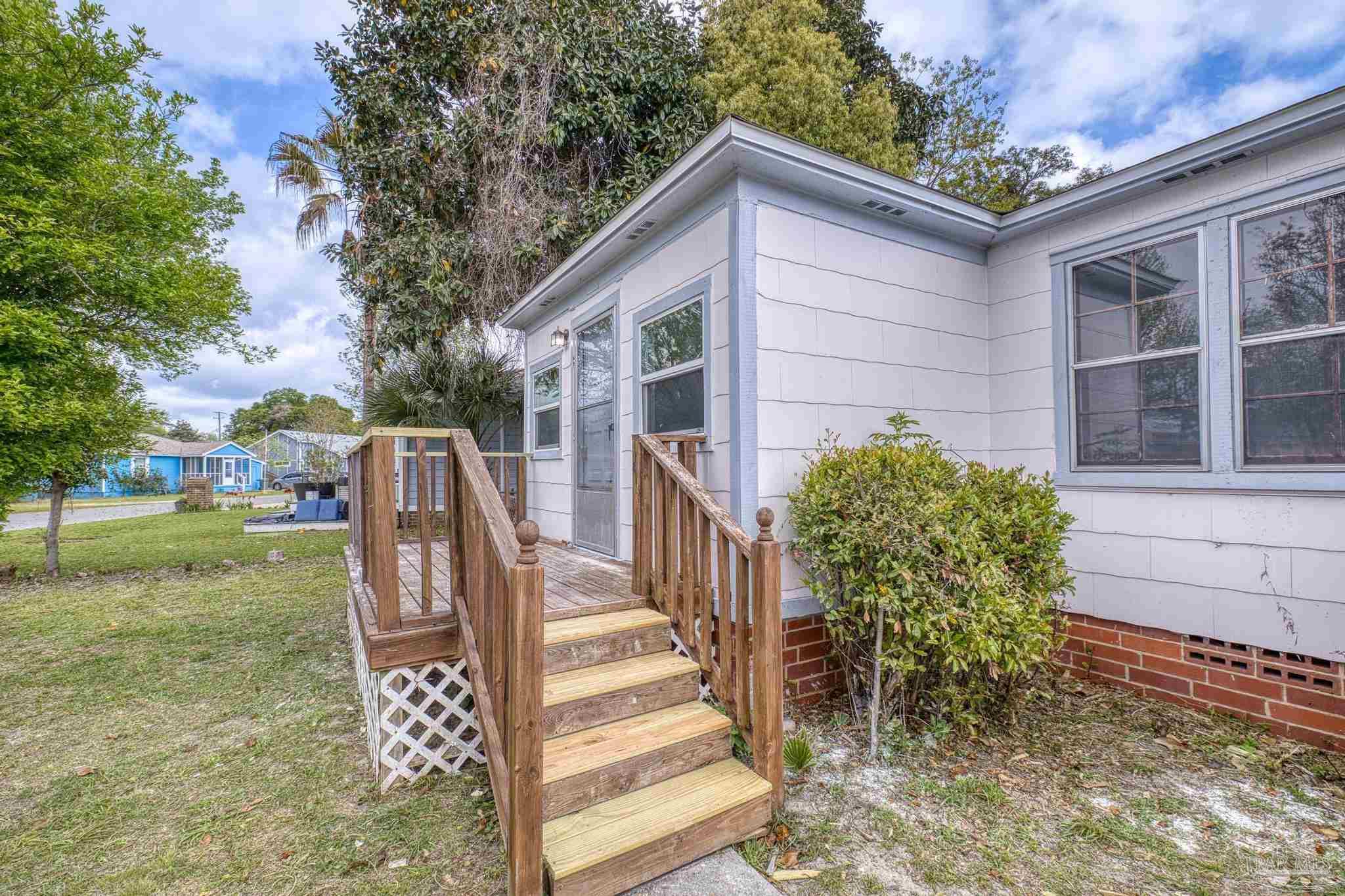 208 Berry Road Pensacola, FL 32507 - Photo 5 of 41 a view of a house with backyard and sitting area