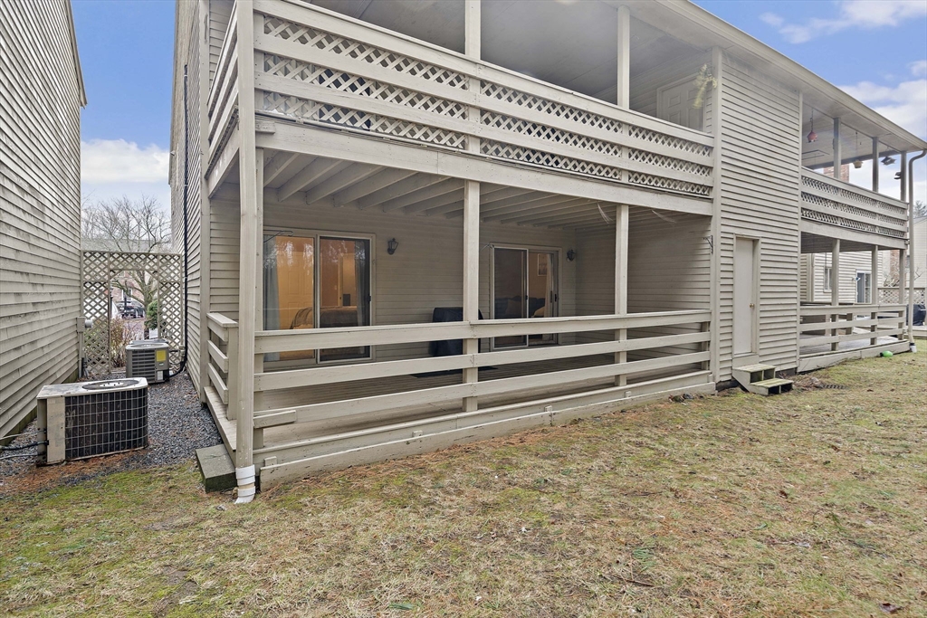 22 Union Square, Unit 22 Randolph, MA 02368 - Photo 27 of 28 a view of a house with a large window and wooden fence