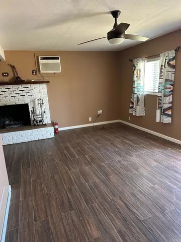 a kitchen with kitchen island a counter space a sink appliances and cabinets