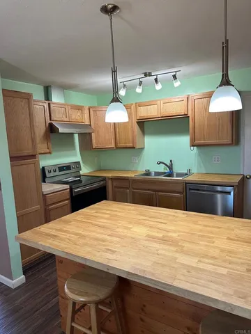a very nice looking kitchen with a wooden floor