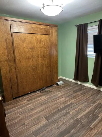 a view of entryway with wooden floor