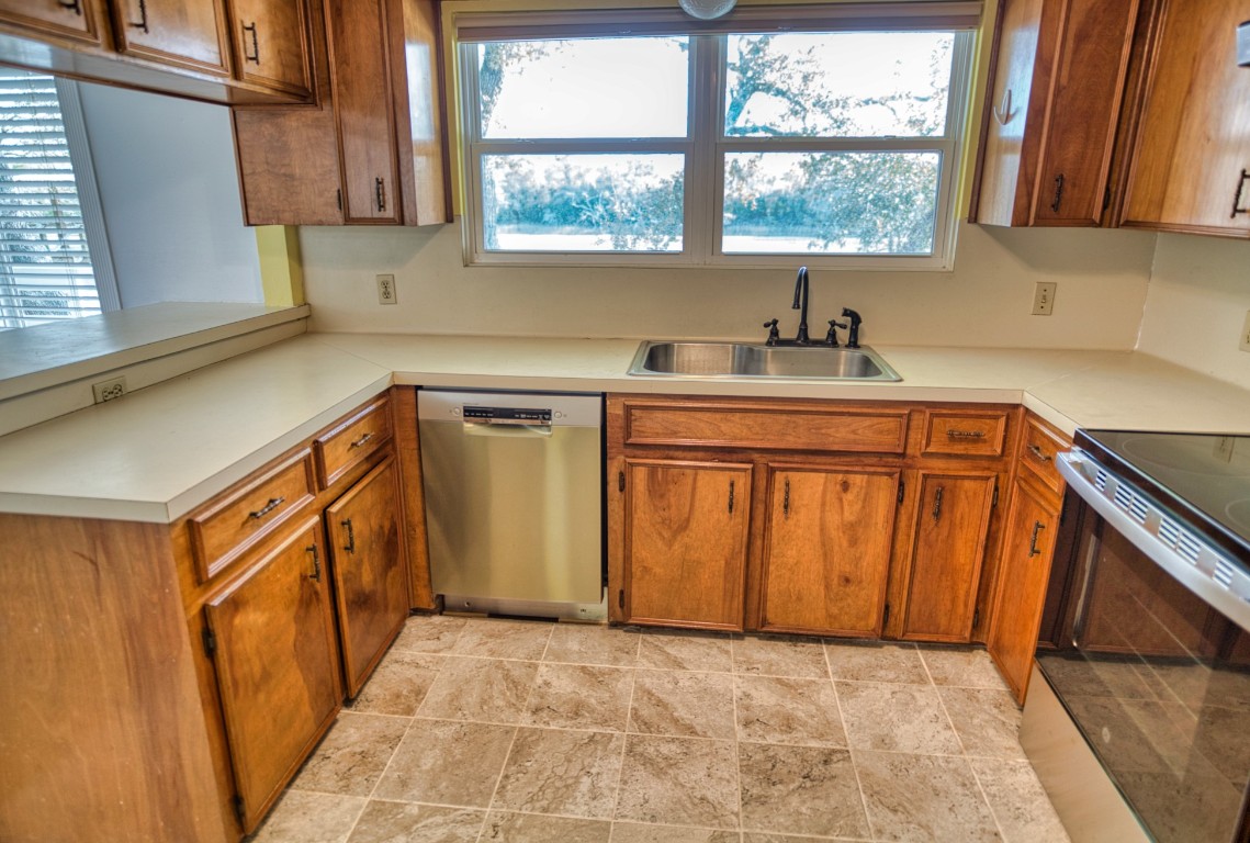 4641 Rio Drive Brazoria, TX 77422 - Photo 12 of 33 a utility room with sink a window and a washer dryer