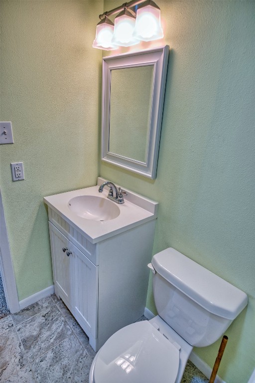 4641 Rio Drive Brazoria, TX 77422 - Photo 17 of 33 a bathroom with a toilet sink and mirror