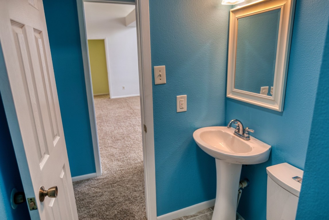 4641 Rio Drive Brazoria, TX 77422 - Photo 22 of 33 a bathroom with a sink a mirror and a toilet