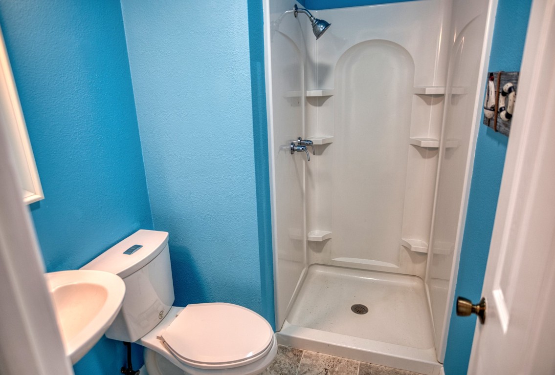 4641 Rio Drive Brazoria, TX 77422 - Photo 23 of 33 a bathroom with a toilet and a shower