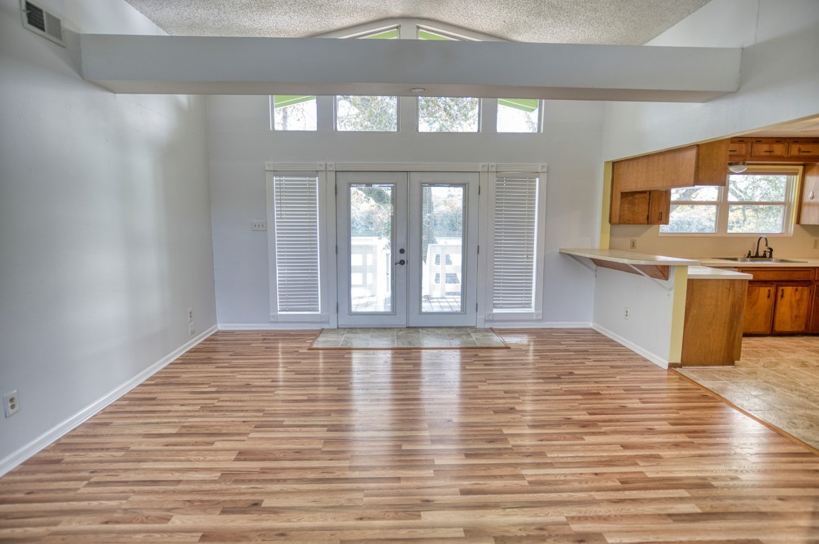 4641 Rio Drive Brazoria, TX 77422 - Photo 9 of 33 a view of an empty room with window and wooden floor
