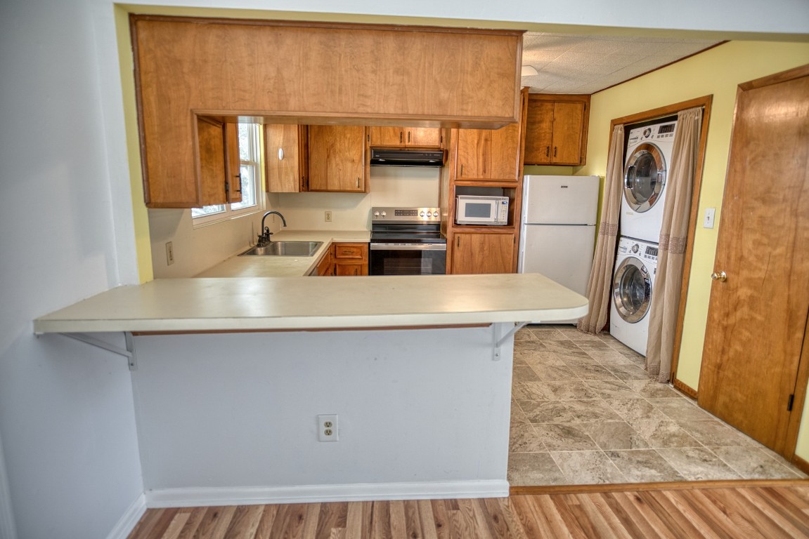 4641 Rio Drive Brazoria, TX 77422 - Photo 10 of 33 a kitchen with a refrigerator and a sink