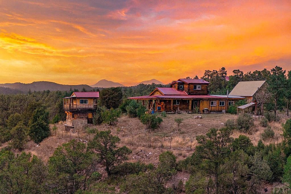 31300 Timber Canyon Road Trinidad, CO 81082 - Photo 1 of 59 a view of a house with a yard and balcony