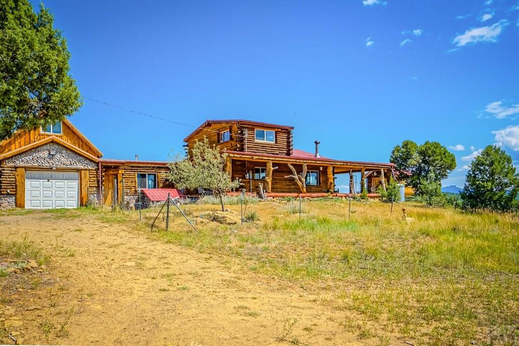 31300 Timber Canyon Road Trinidad, CO 81082 - Photo 26 of 59 a front view of a house with a yard