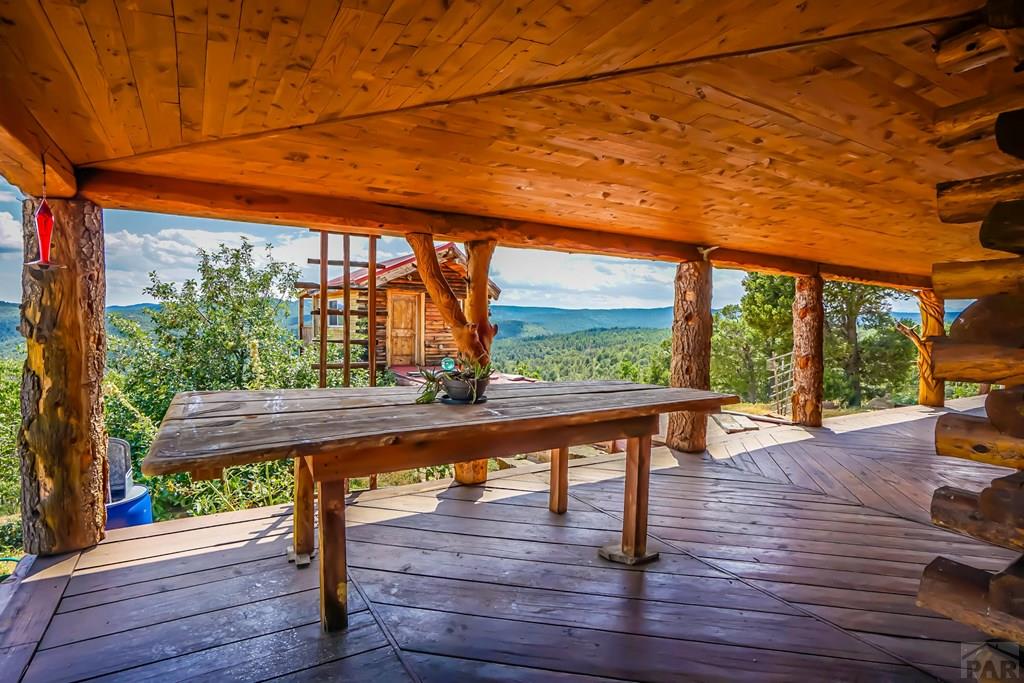 31300 Timber Canyon Road Trinidad, CO 81082 - Photo 43 of 59 a view of a wooden deck with a bench