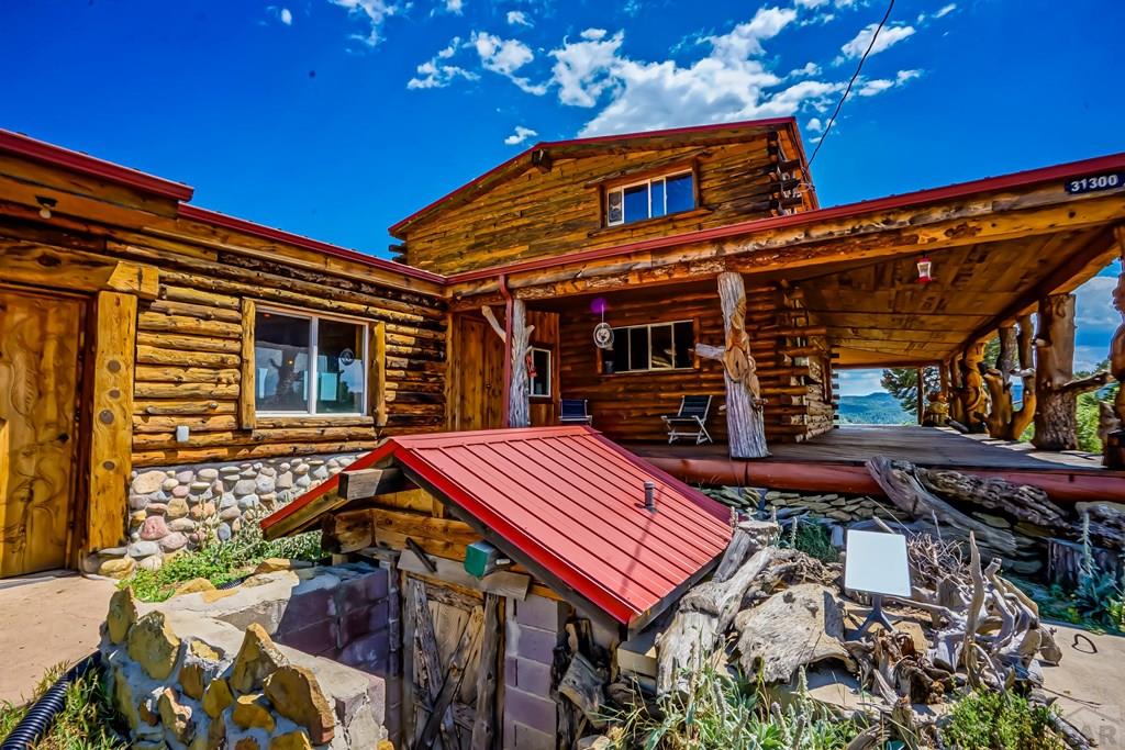 31300 Timber Canyon Road Trinidad, CO 81082 - Photo 51 of 59 a red and white building with a large window