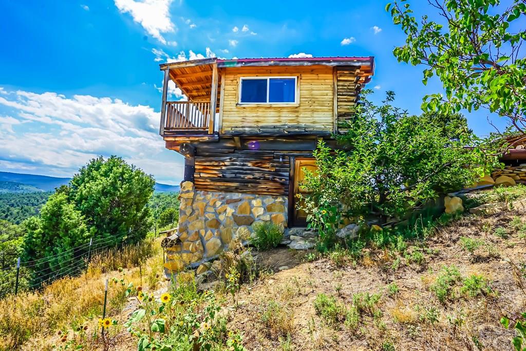 31300 Timber Canyon Road Trinidad, CO 81082 - Photo 52 of 59 a view of a house with a yard