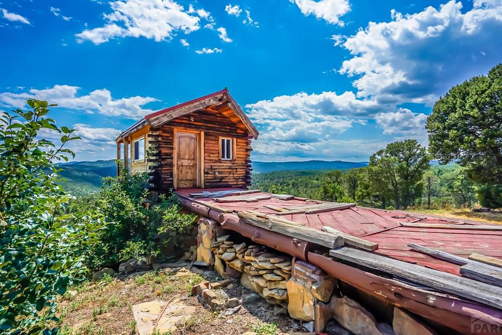 31300 Timber Canyon Road Trinidad, CO 81082 - Photo 53 of 59 a view of a patio with table and chairs and potted plants